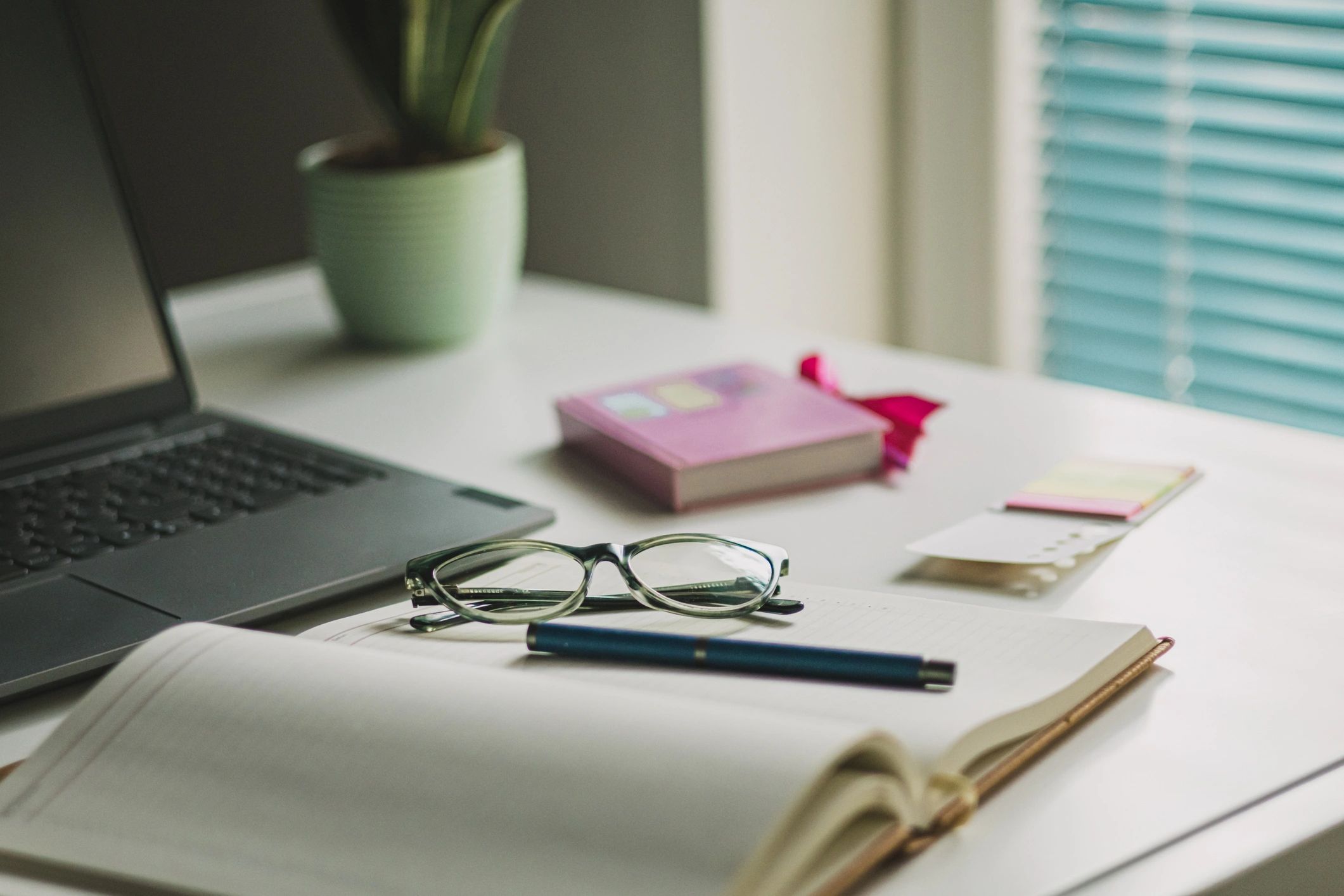 Business planning desk with laptop and office supplies